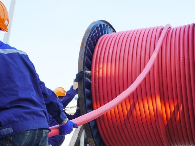 Workers,Pulling,High,Voltage,Cable,Line,Or,Large,Electric,Cable